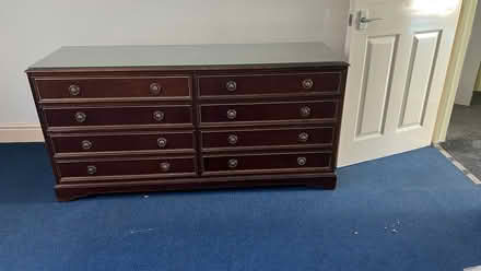 Photo of free Mahogany 8 drawers glass top wide chest. Great condition. (Olympia W14) #1