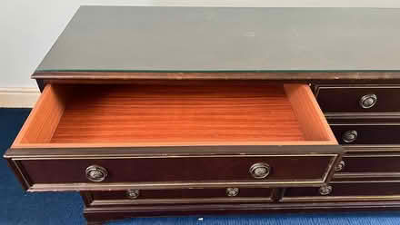 Photo of free Mahogany 8 drawers glass top wide chest. Great condition. (Olympia W14) #2