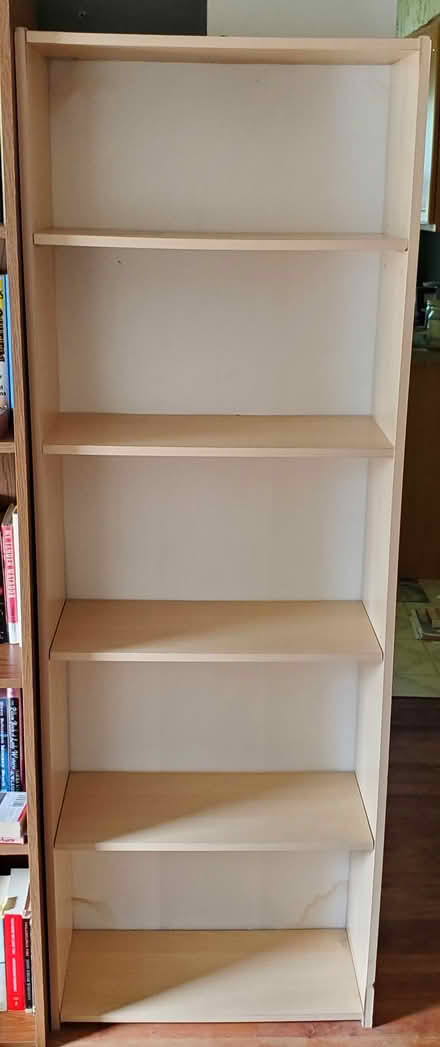 Photo of free Particle board bookshelf (Ann Arbor Northwest Side) #1