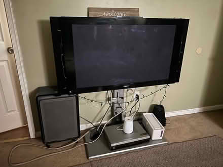 Photo of free Tv including stand w/ glass shelves (College Park, MD) #1