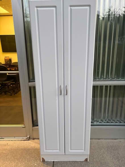 Photo of free Storage cabinet (2516 sommerset center dr WS) #1