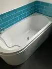 Photo of free White bath tub with taps and shower attachment (Roundwood AL5) #1