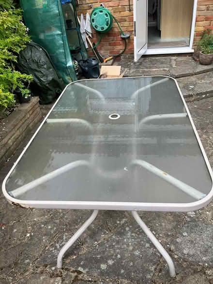 Photo of free Outdoor glass topped patio table (Carshalton) #1