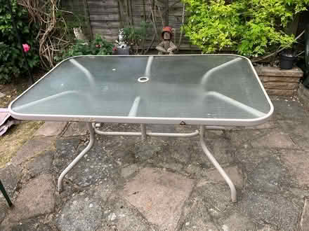 Photo of free Outdoor glass topped patio table (Carshalton) #3