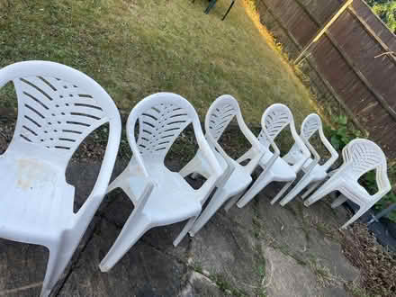 Photo of free 8 white patio chairs (Catshill B61 0) #1
