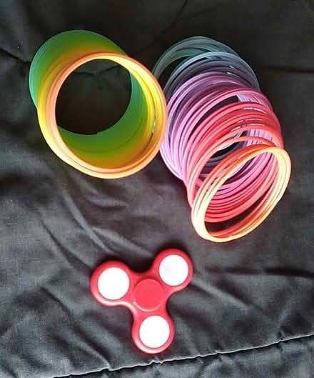 Photo of free 2 Slinkies and a Spinner (Oakland) #1