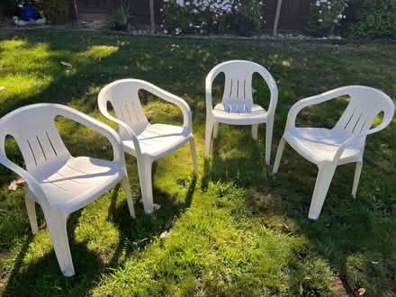 Photo of free Four stackable plastic chairs (South Walnut Creek) #1