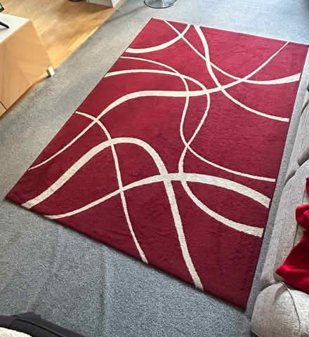 Photo of free Dark red rug & grey carpet (Plantation wharf SW11) #1