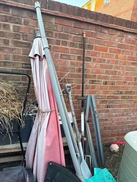 Photo of free Umbrella and one weight for it (Mudchute E14) #3