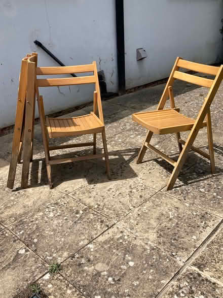 Photo of free Folding wooden chairs (4) (Guildford, SW, GU2) #1