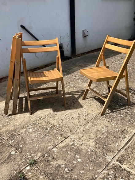 Photo of free Folding wooden chairs (4) (Guildford, SW, GU2) #2