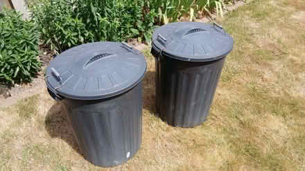 Photo of free Two black plastic dustbins with lids. (Langdon Hills SS16) #2