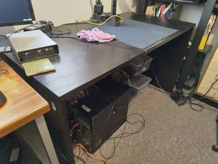 Photo of free Black veneer desk 131 x 67 cm. (Reabrook Estate SY3) #1