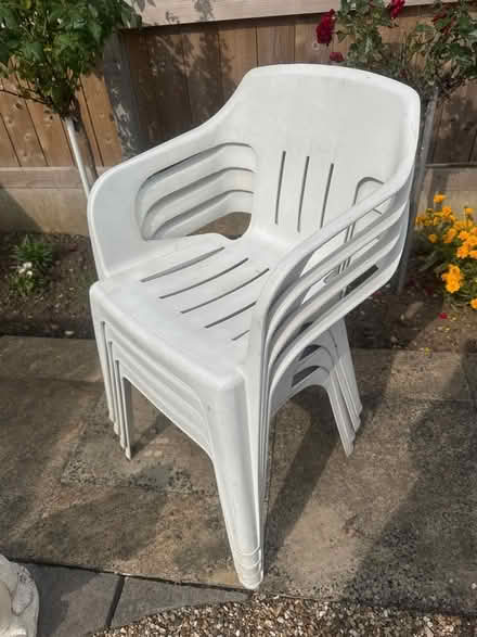Photo of free Plastic garden stacking chairs 4 white 2 green (Bridlington YO16) #1