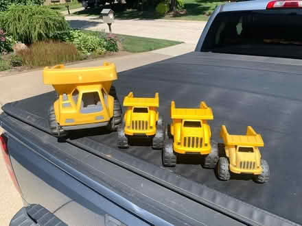 Photo of free Four Plastic Toy Trucks (South Rochester Hills) #1