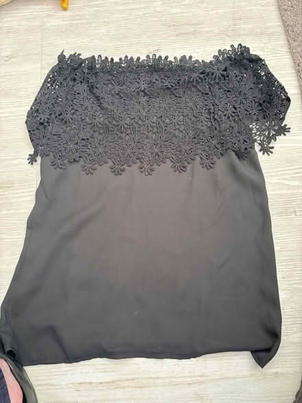 Photo of free Black strapless top with lacy flower details M (Brierlow Bar SK17) #1