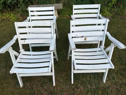 Photo of free Four wooden folding outdoor chairs (Knotty Green HP9) #1