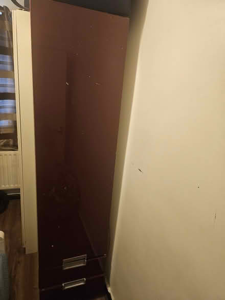 Photo of free Tall wood cupboard (Mortlake) #1