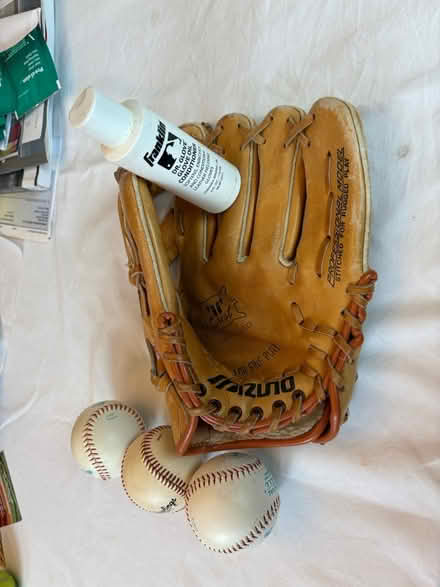 Photo of free Baseball glove and baseballs (Waltham near Belmont line) #1