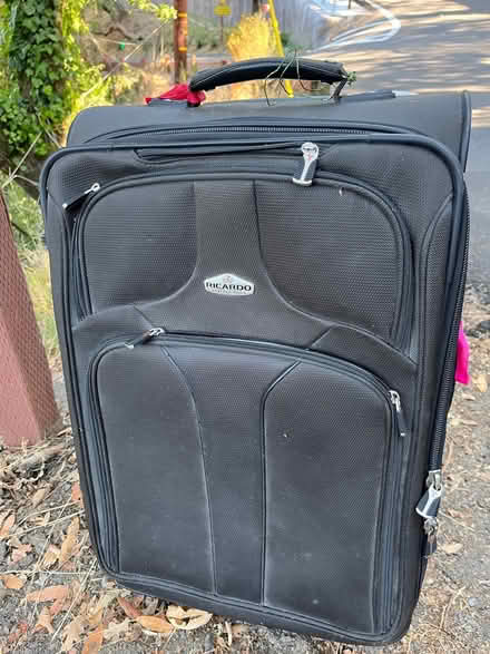 Photo of free Used luggage on wheels & trash bin (94 Southern Heights Blvd SR) #1