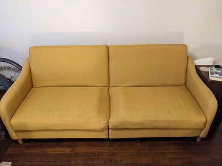Photo of free Yellow fold out couch (Kingman Park) #1