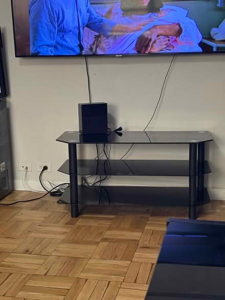 Photo of free Glass TV stand (Harlem, NY) #1