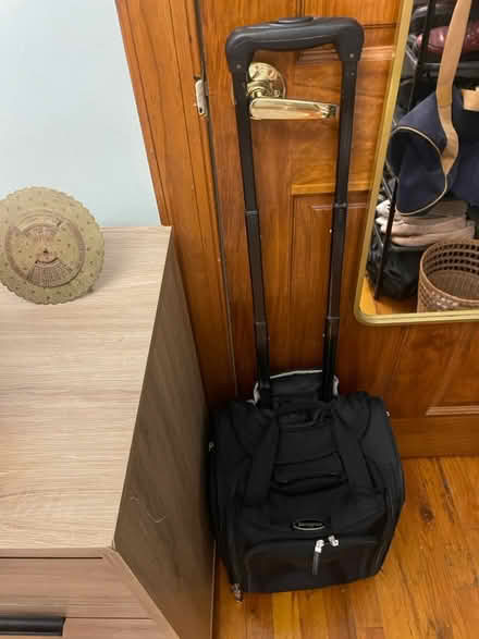 Photo of free Suitcase (1 wheel needs repair) (108 and Broadway) #1