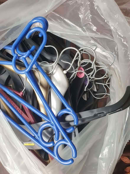 Photo of free Bag of assorted plastic coat hangers (Lexden CO3) #1