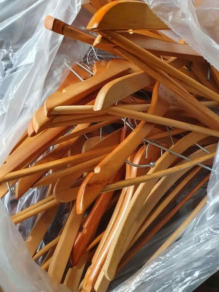 Photo of free Bag of assorted wood coat hangers (Lexden CO3) #1