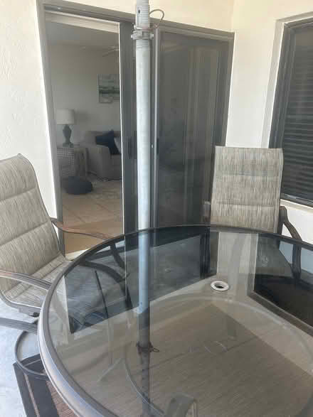 Photo of free Round glass top table and 4 chairs (Daytona Beach Shores) #1