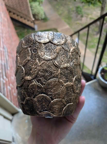 Photo of free Coin-decorated Planter (NRG stadium) #1