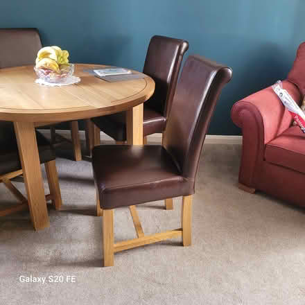 Photo of free Leather chairs x4, oak legs (Cottingham) #1