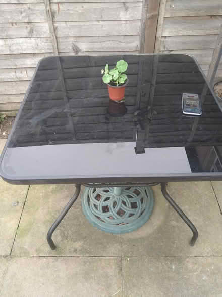 Photo of free Glass top patio table (DE23 sinfin) #2
