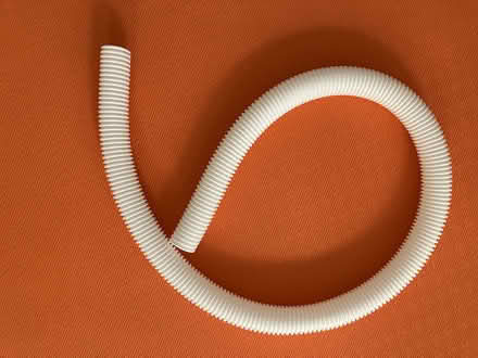 Photo of free white cable sleeve (NoHo 10012) #1