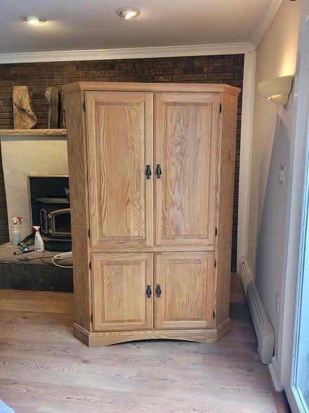 Photo of free Oak Corner Cabinet (Rockaway Borough) #1