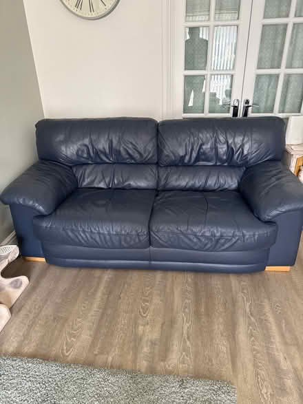 Photo of free 2 blue leather sofas &one footstall (Trowbridge BA14) #1