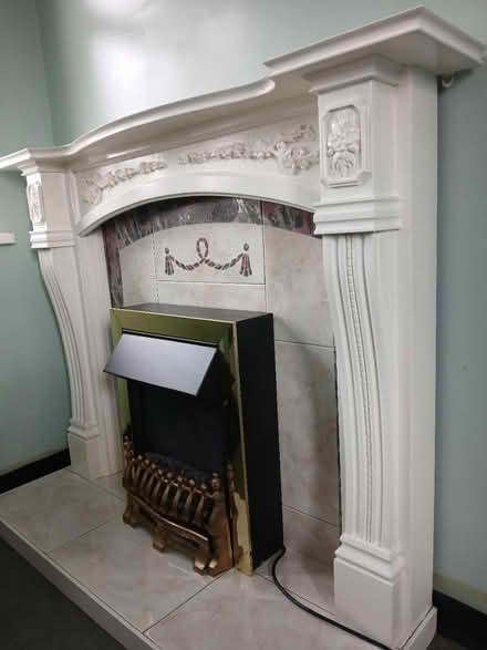 Photo of free Fire surround with electric fire (Ts19 Hardwick) #1