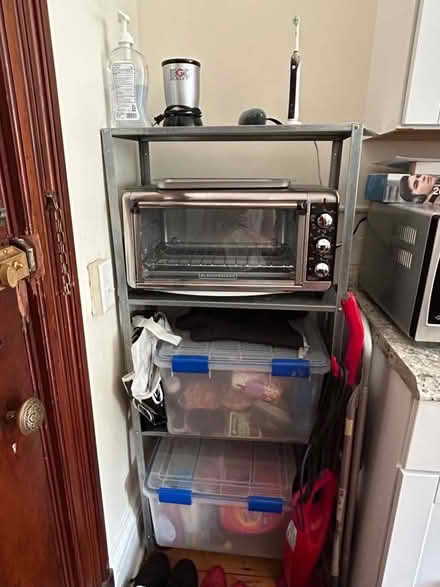 Photo of free Ikea Metal 4-Shelf Unit (Newbury St., Back Bay) #1