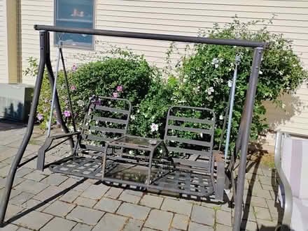Photo of free Two person middle patio swing (DeWitt) #1