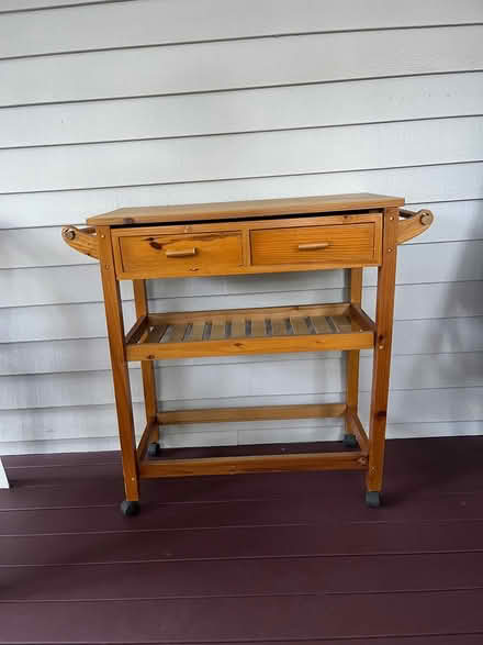 Photo of free Small wooden table on wheels (Winchester, west side) #1