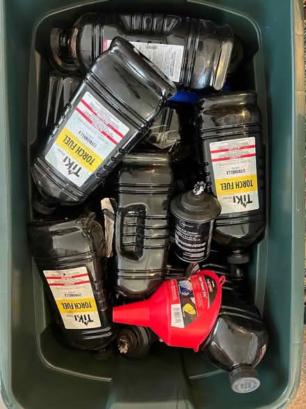 Photo of free Bin of Tiki Torch Fuel and torches (New Paltz) #1