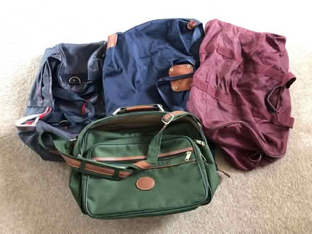 Photo of free 4 luggage bags - green one m&s (L17 Aigburth) #1