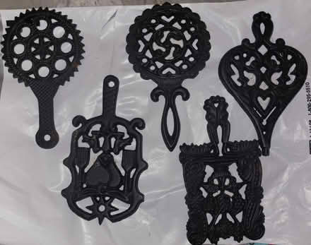 Photo of free 5 mini cast iron trivets (Bloomingdale) #1