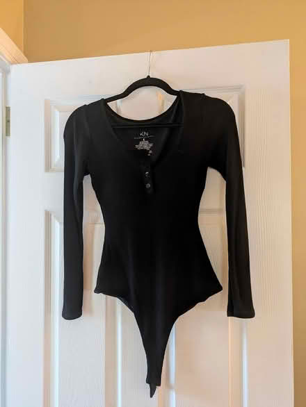 Photo of free Black long sleeve body suit (22308) #1