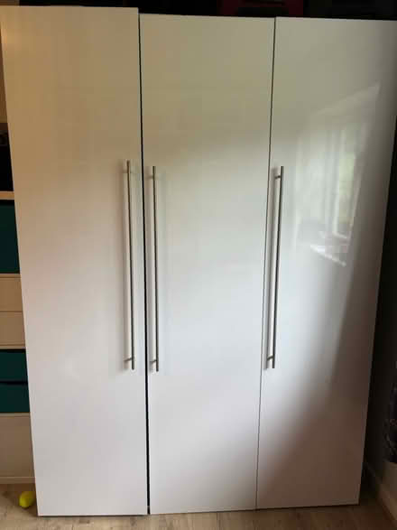 Photo of free 3 door tall gloss white wardrobe (Boreham Street) #1