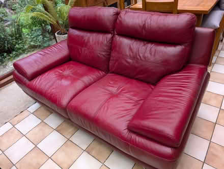 Photo of free Two seater leather sofa in red (North Woodchester GL5) #1