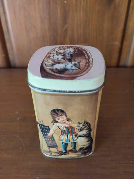 Photo of free Small child and cat tin (Ann Arbor Northwest Side) #2