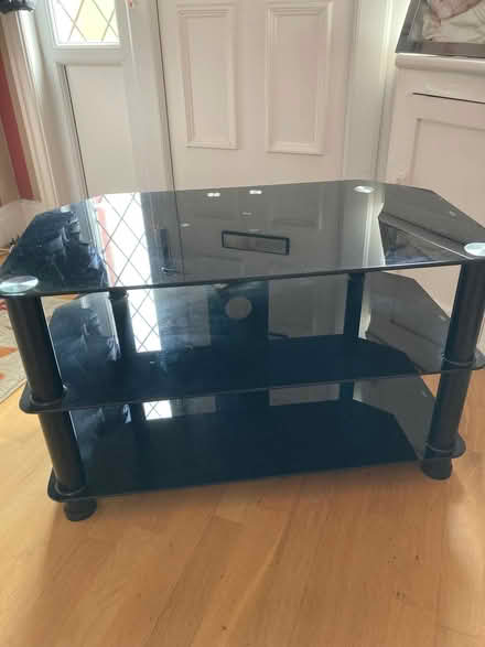 Photo of free Black glass television stand (Cross Gates LS15) #1
