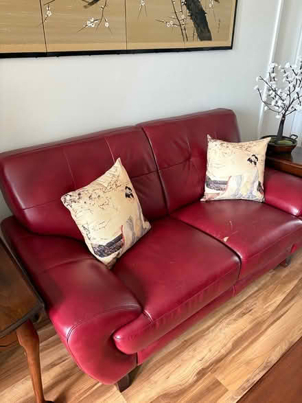 Photo of free Red leather loveseat (Pelican area Cape Coral) #1