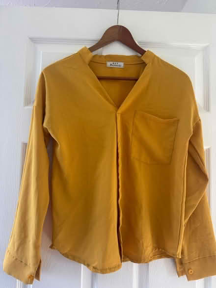 Photo of free Yellow long sleeve shirt top size 8 (GL3) #1